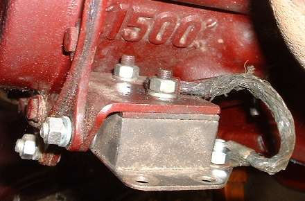 Ground strap installed across left engine mount