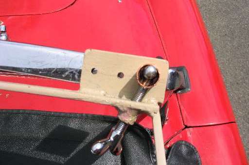 Ragtop frame attached to windscreen