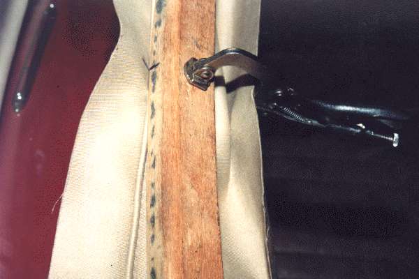 Clamp on header rail with fabric wrap underneath