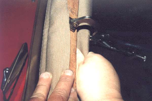Positioning wrap fabric on header rail